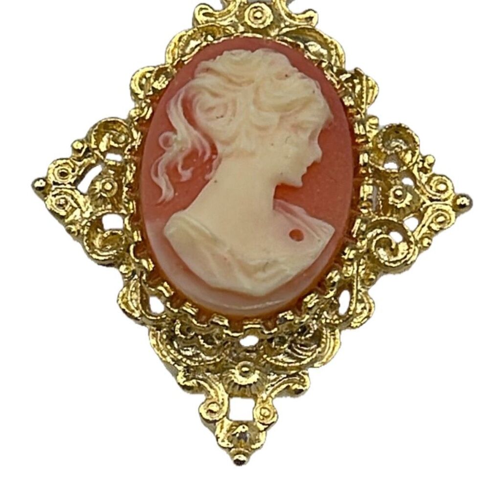 Vintage Gerry’s cameo brooch with ornate frame.